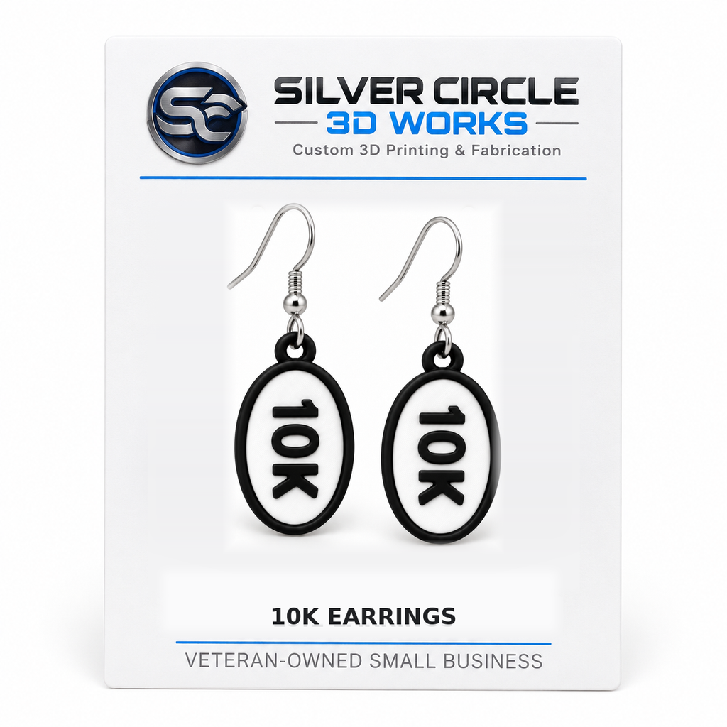 Pair of 10K oval distance earrings mounted on branded Silver Circle 3D Works display card
