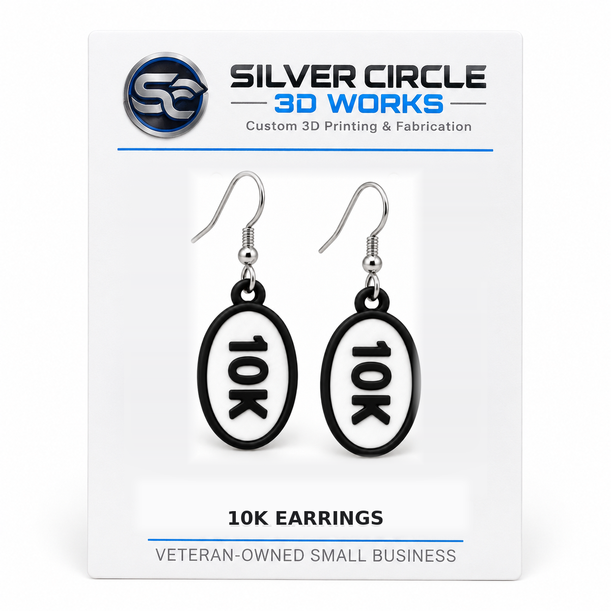 Pair of 10K oval distance earrings mounted on branded Silver Circle 3D Works display card