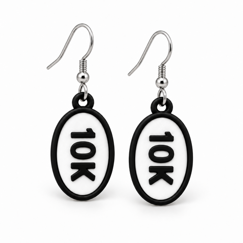 Close-up pair of black-and-white 10K oval distance earrings