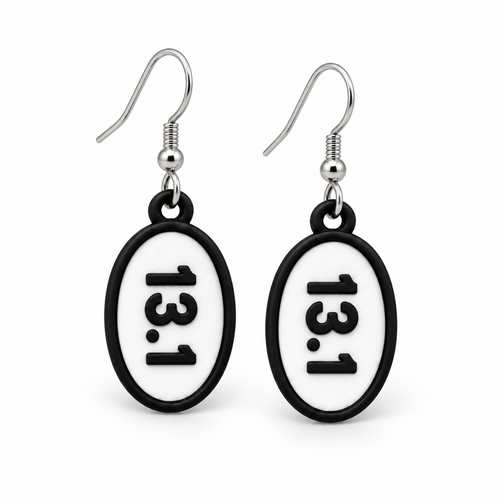 Close-up pair of black-and-white 13.1 oval distance earrings