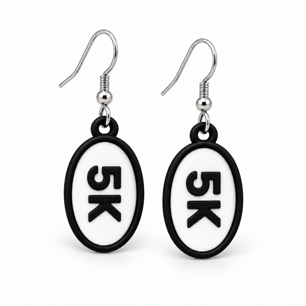 Close-up pair of black-and-white 5K oval distance earrings