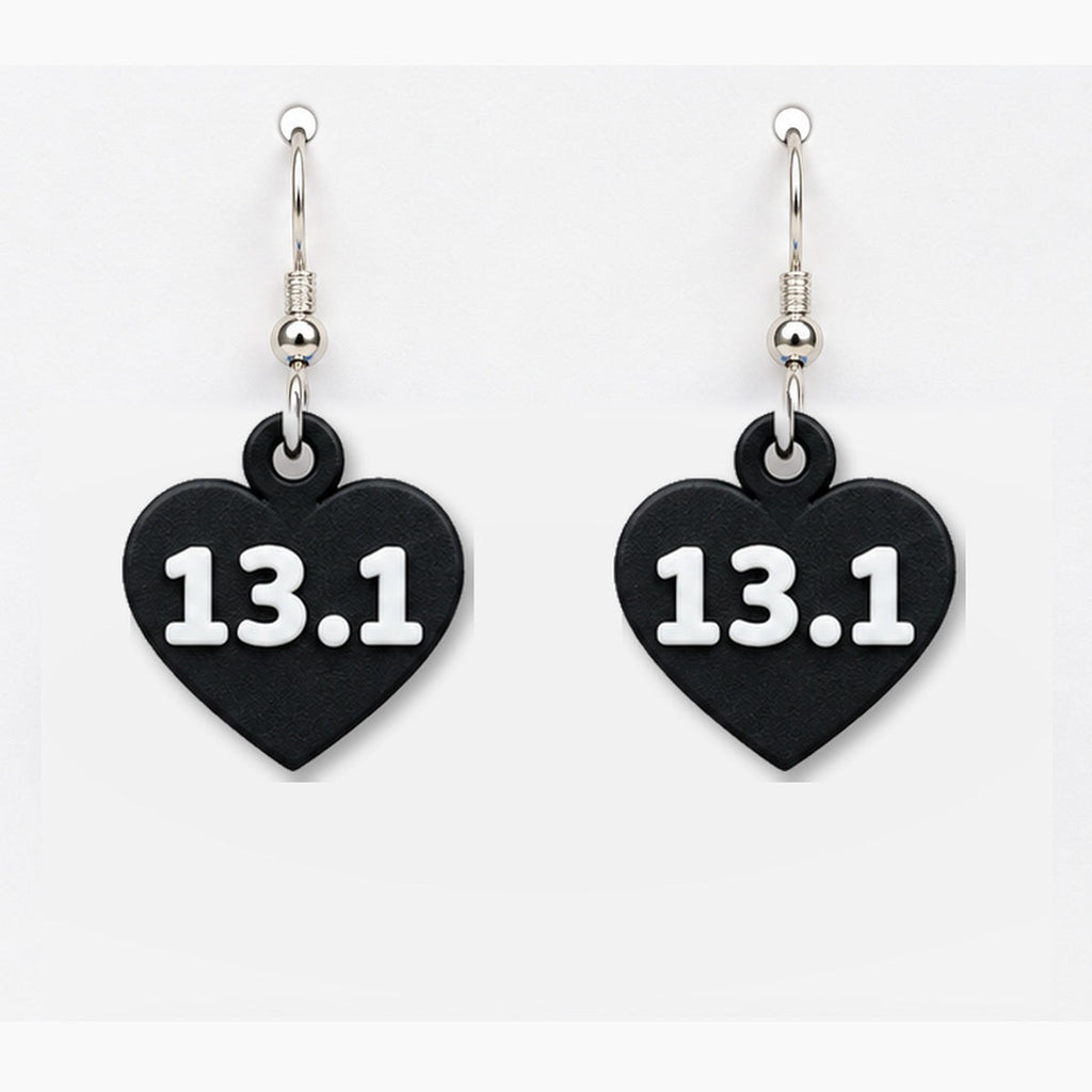 Close-up black 13.1 heart earring pair