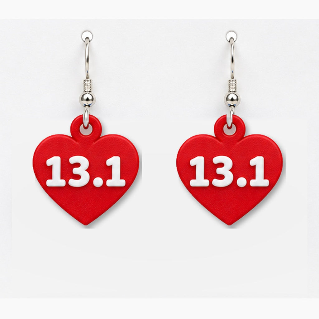 Close-up red 13.1 heart earring pair
