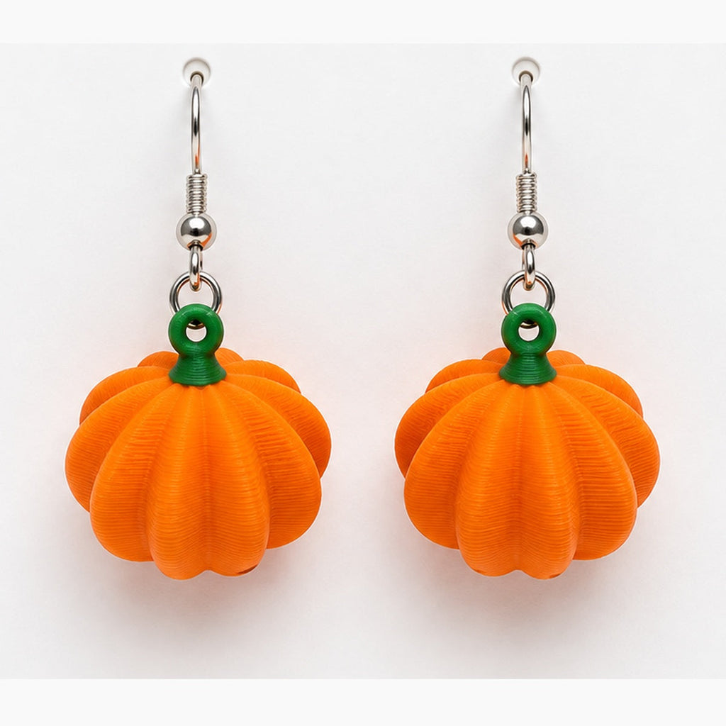 Close-up dimensional pumpkin earrings