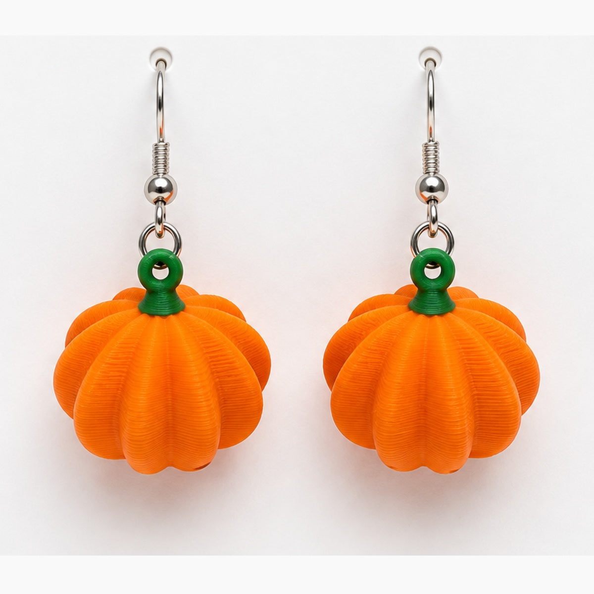 Close-up dimensional pumpkin earrings