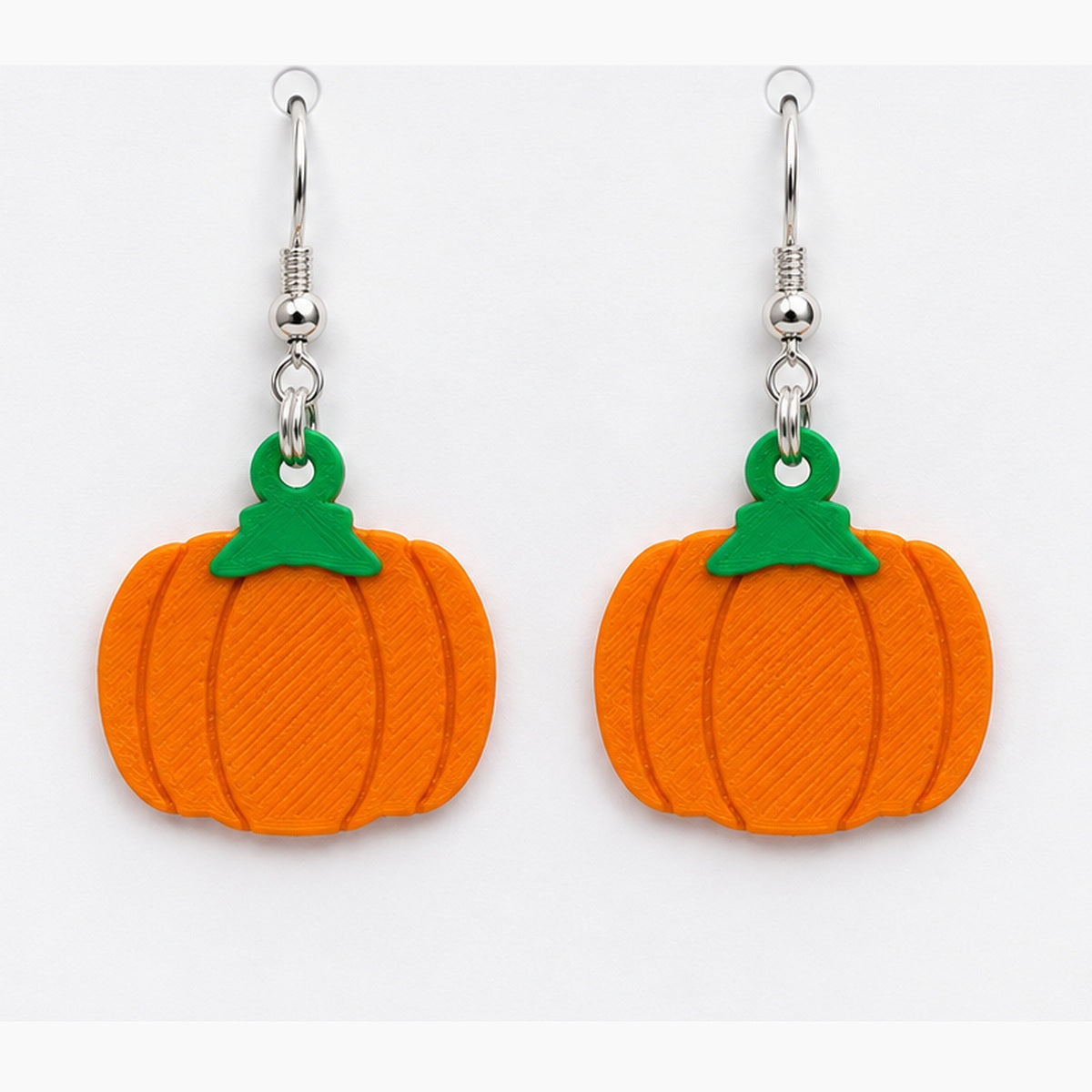 Close-up flat pumpkin earrings