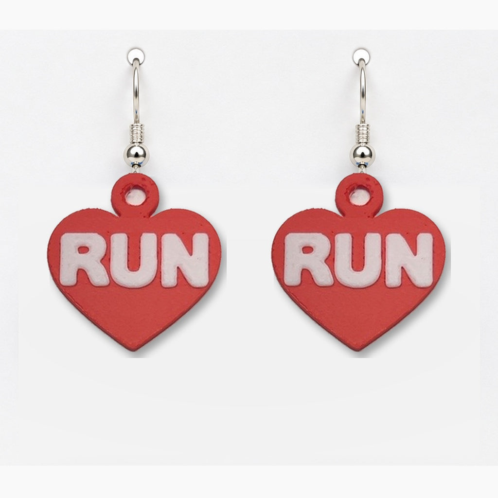 Close-up red RUN heart earring pair