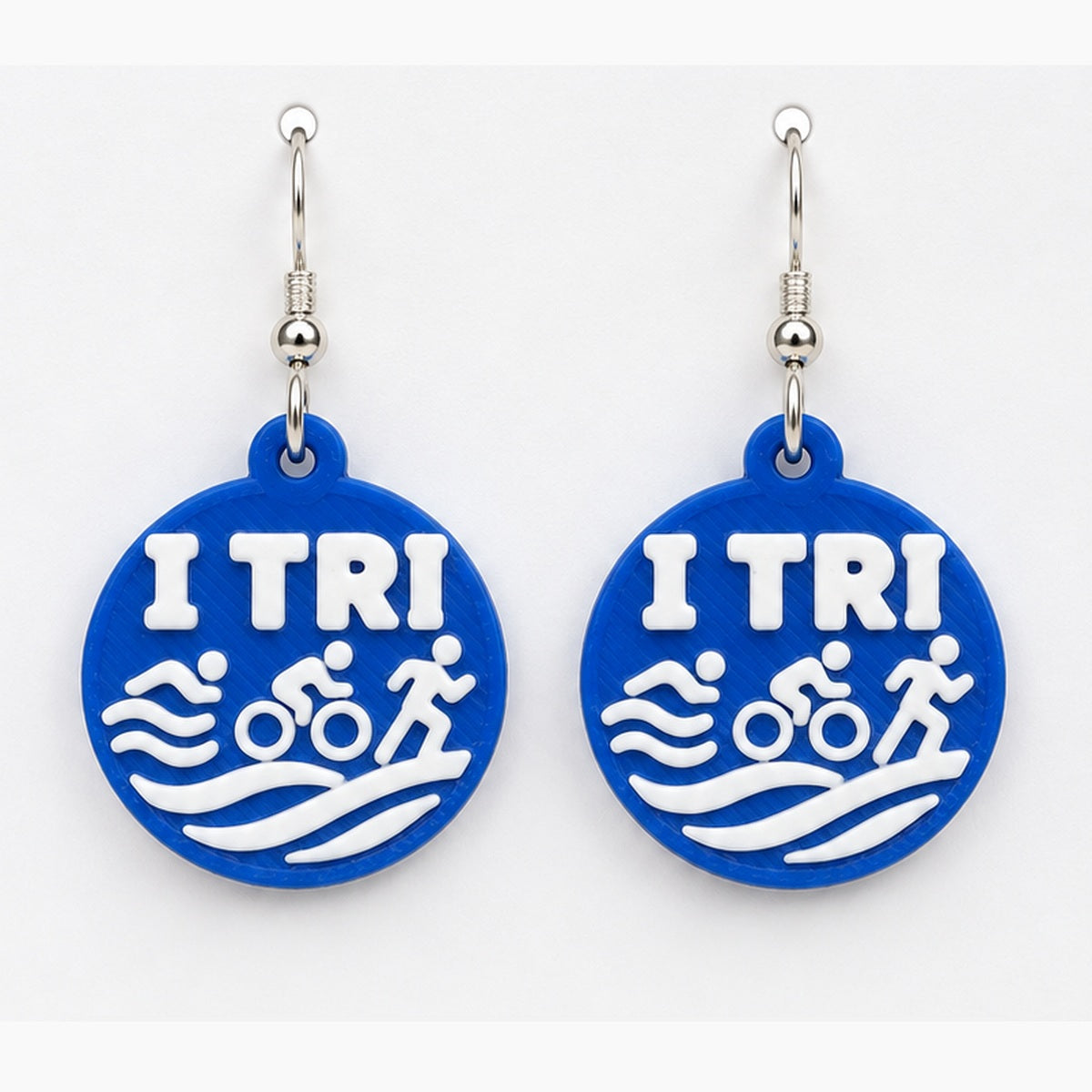 Close-up TRI earring pair with silver hooks