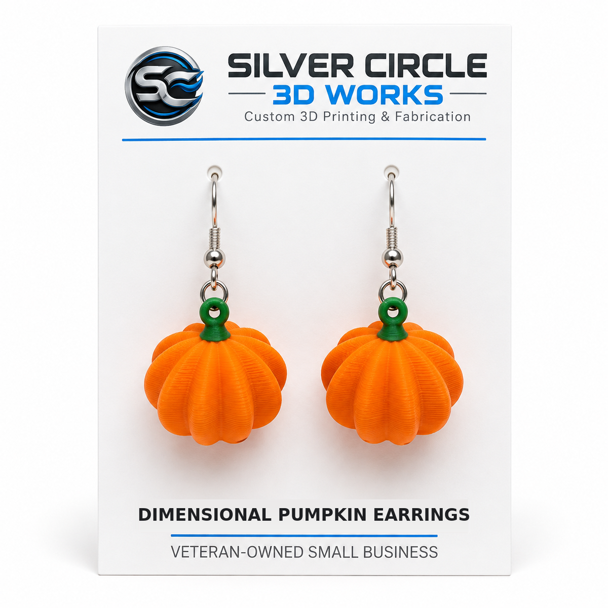 Dimensional pumpkin earrings on Silver Circle 3D Works backing card labeled Dimensional Pumpkin Earrings