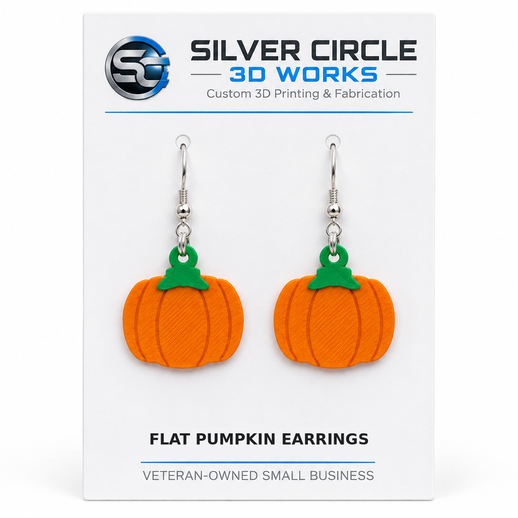 Flat pumpkin earrings on Silver Circle 3D Works backing card labeled Flat Pumpkin Earrings