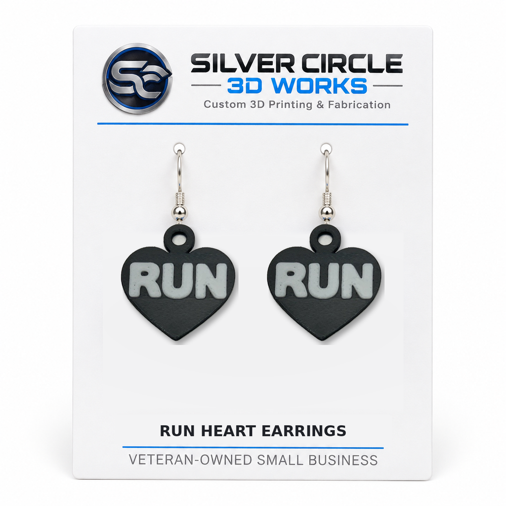 Black RUN heart earrings on branded backing card, one pair
