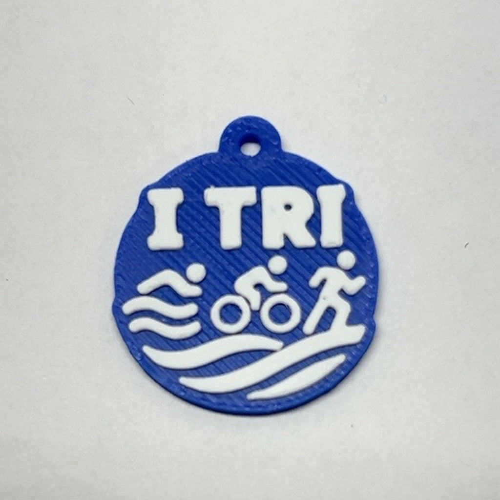 Blue and white TRI 3D printed earring with swim bike run icons