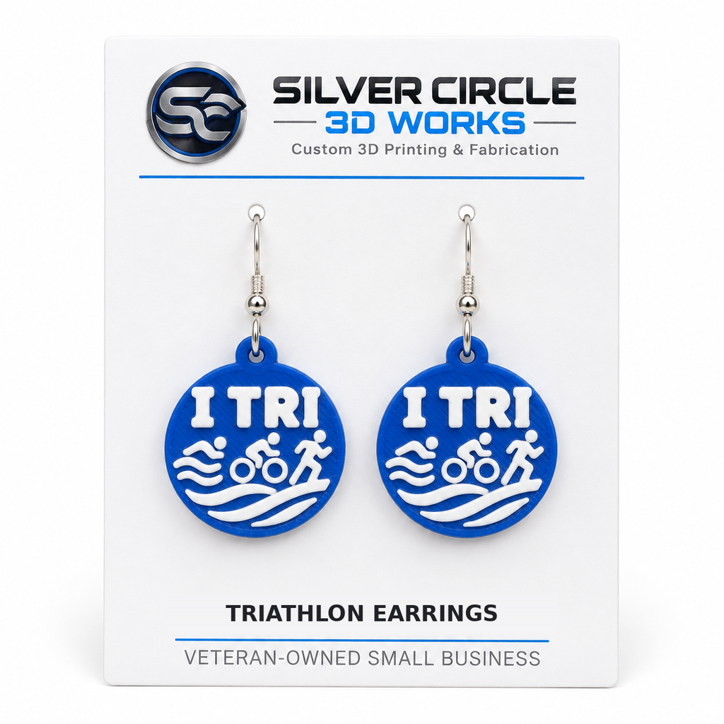 Blue TRI earrings with silver hooks mounted on Silver Circle 3D Works backing card